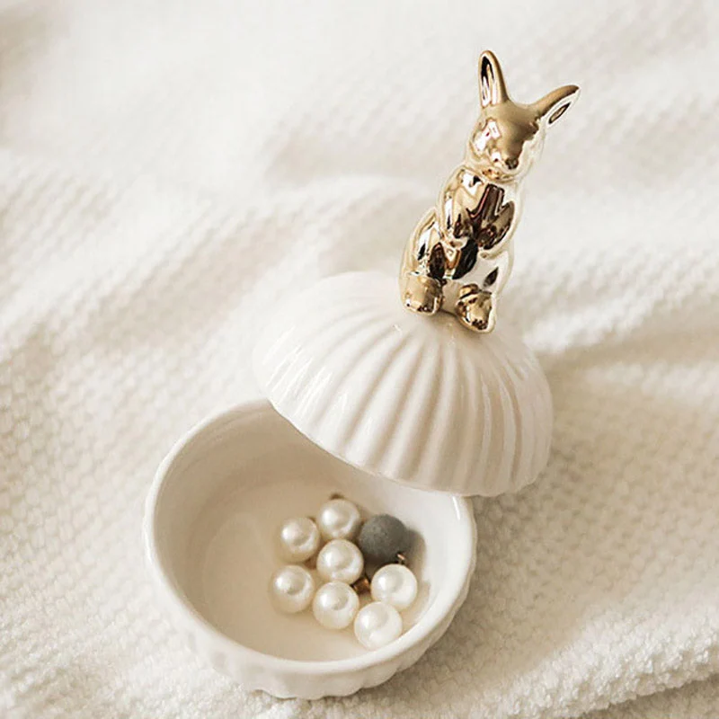 vanity storage jar with gold animal handle