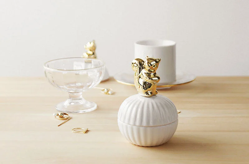 vanity storage jar with gold animal handle