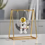 Astronaut Riding a Swing tag1