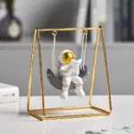 Astronaut Riding a Swing tag1
