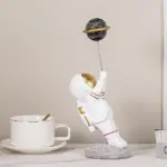 Astronaut with Planet Balloon tag1