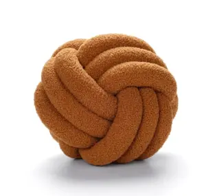 The knotted brown bouclé cushion: Luxurious cushion made of brown bouclé wool