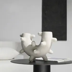 Curved Cylindrical Sculpture with Elongated Spheres