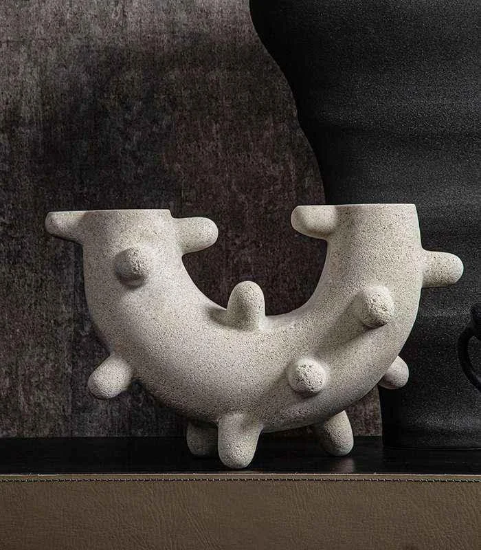 Curved Cylindrical Sculpture with Elongated Spheres -  - #tag1#