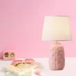 Eclat design table lamp with conical shade and cylindrical ceramic base tag1
