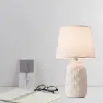 Eclat design table lamp with conical shade and cylindrical ceramic base tag1