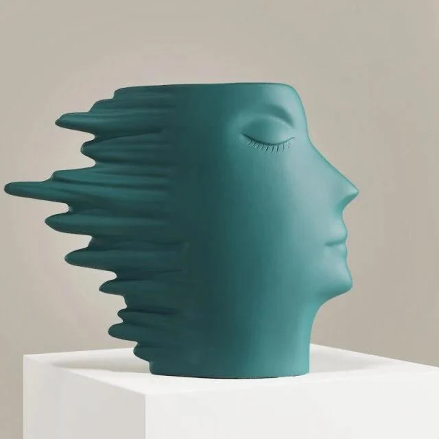 Faces in the Wind Vase -