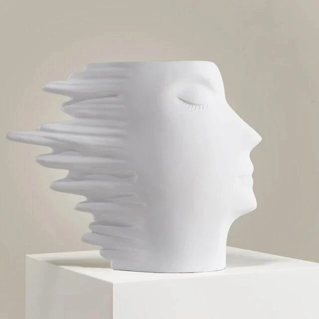 Faces in the Wind Vase -