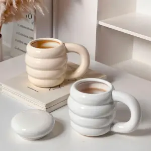 Handmade porcelain tea cup with lid