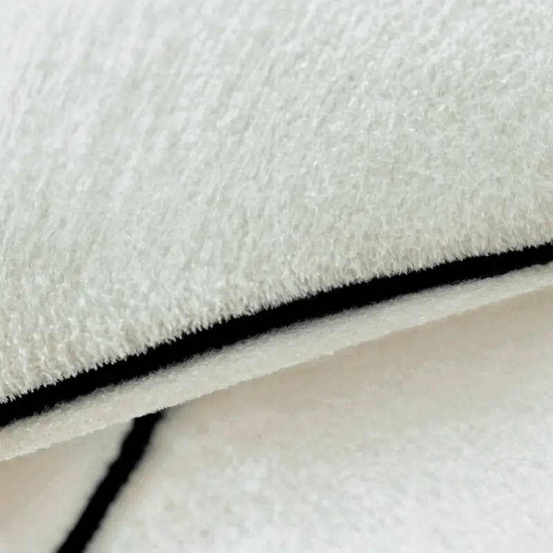 Hayle Rug Round wool rug with irregular shape and minimalist style tag1