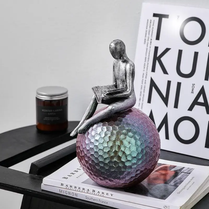 Man On Sphere Sculpture
