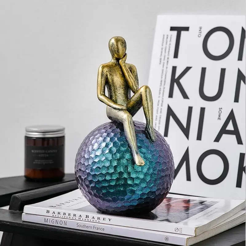 Man On Sphere Sculpture