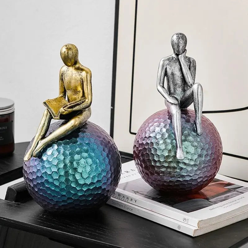 Man On Sphere Sculpture
