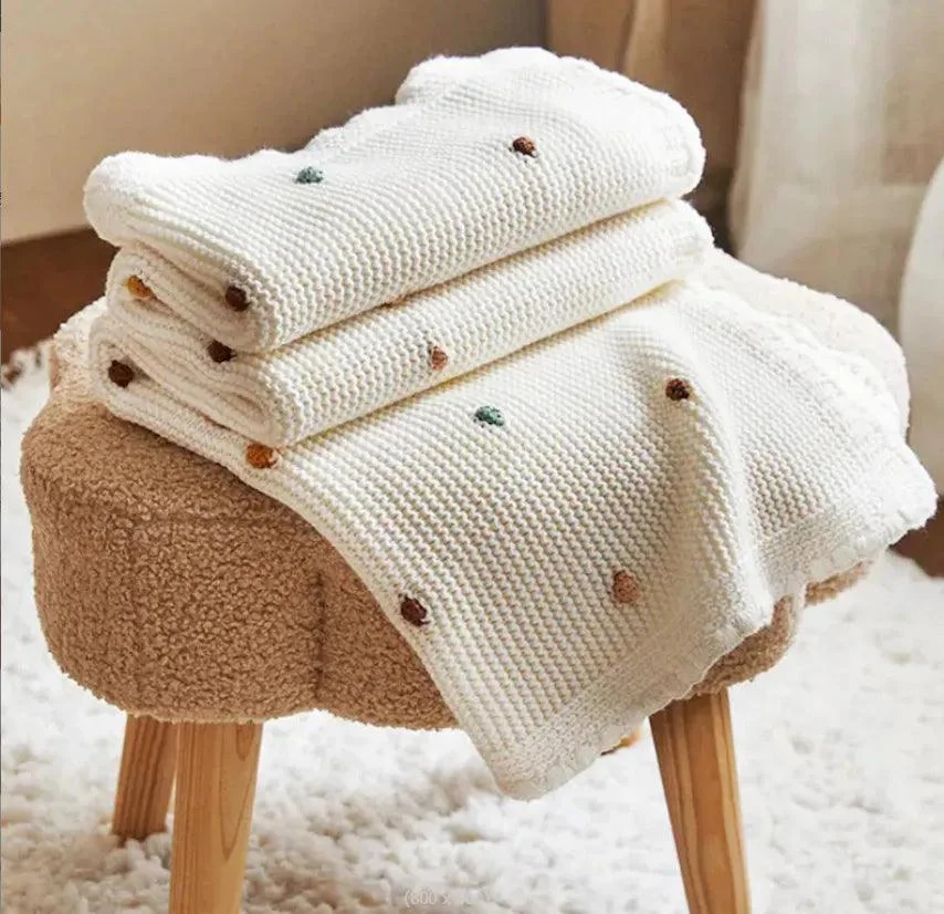 Nordic Pompom Baby Blanket: Cozy and Adorable -