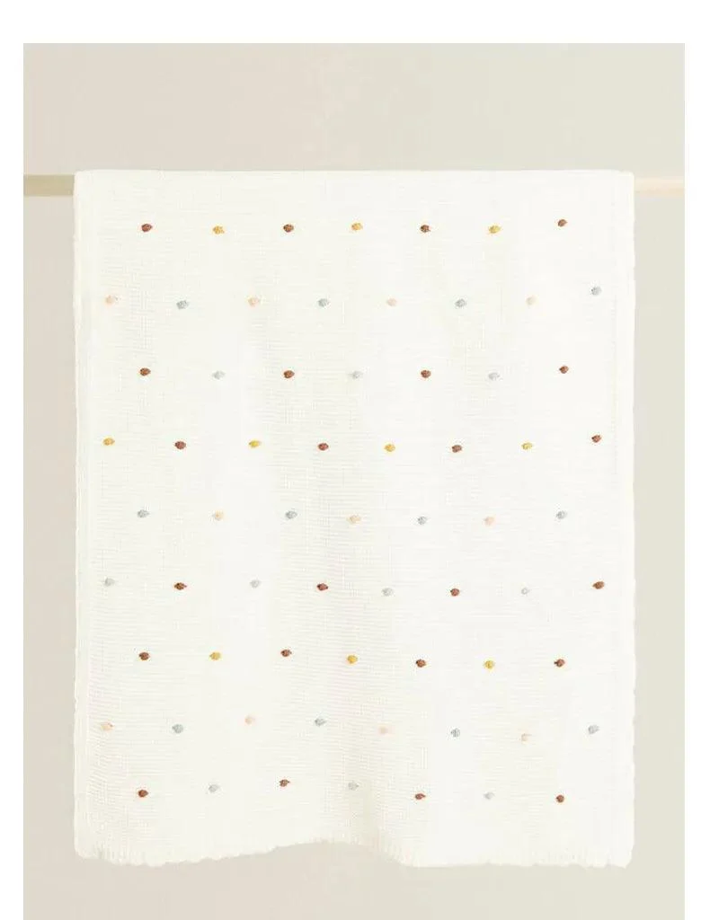 Nordic Pompom Baby Blanket: Cozy and Adorable -
