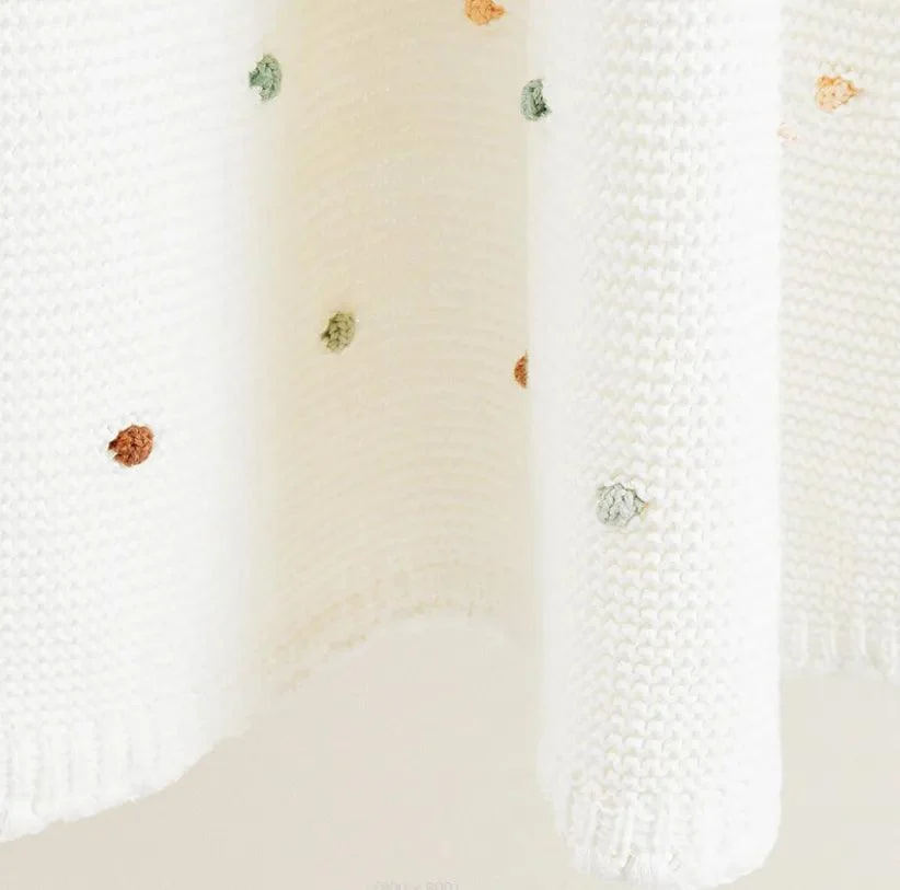 Nordic Pompom Baby Blanket: Cozy and Adorable -