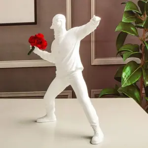 Harmony in Motion Sculpture Man Throwing Flower