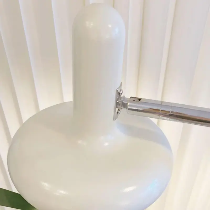 VintageBauhausTwoHeadsSofaBesideGlassFloorLamp 9 2db8c04d 5431 4344 add1 abb553270821