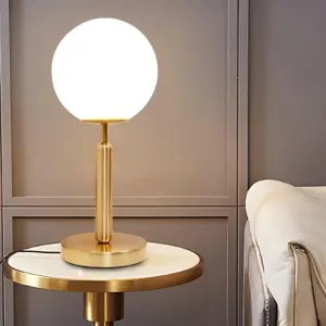 Homeko â LED table lamp with glass ball and brass
