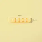 Pastel coloured cable organiser clip