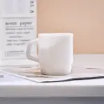 Pastel coloured stackable glass mug
