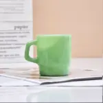 Pastel coloured stackable glass mug