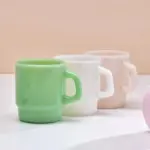 Pastel coloured stackable glass mug