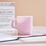 Pastel coloured stackable glass mug