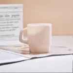 Pastel coloured stackable glass mug