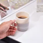 Pastel coloured stackable glass mug