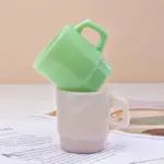 Pastel coloured stackable glass mug