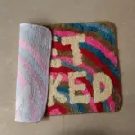 Rainbow get naked tufted bath mat