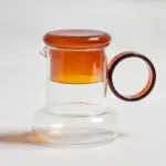 Retro style glass pitcher with lid matching cup