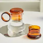 Retro style glass pitcher with lid matching cup