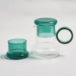 Retro style glass pitcher with lid matching cup