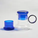 Retro style glass pitcher with lid matching cup