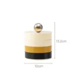 Rotating storage box with contrasting lid