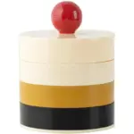 Rotating storage box with contrasting lid