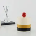 Rotating storage box with contrasting lid