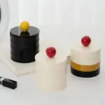 Rotating storage box with contrasting lid