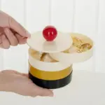 Rotating storage box with contrasting lid