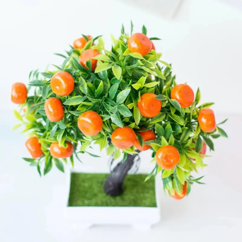 Small artificial potted bonsai fruit tree