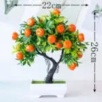 Small artificial potted bonsai fruit tree