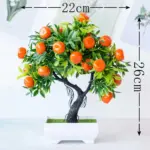Small artificial potted bonsai fruit tree