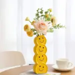Smiling faces ceramic vase with artificial flowers