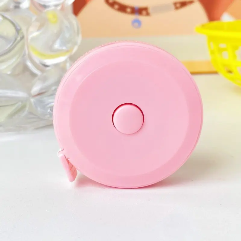 Soft pastel coloured double scale tape measure