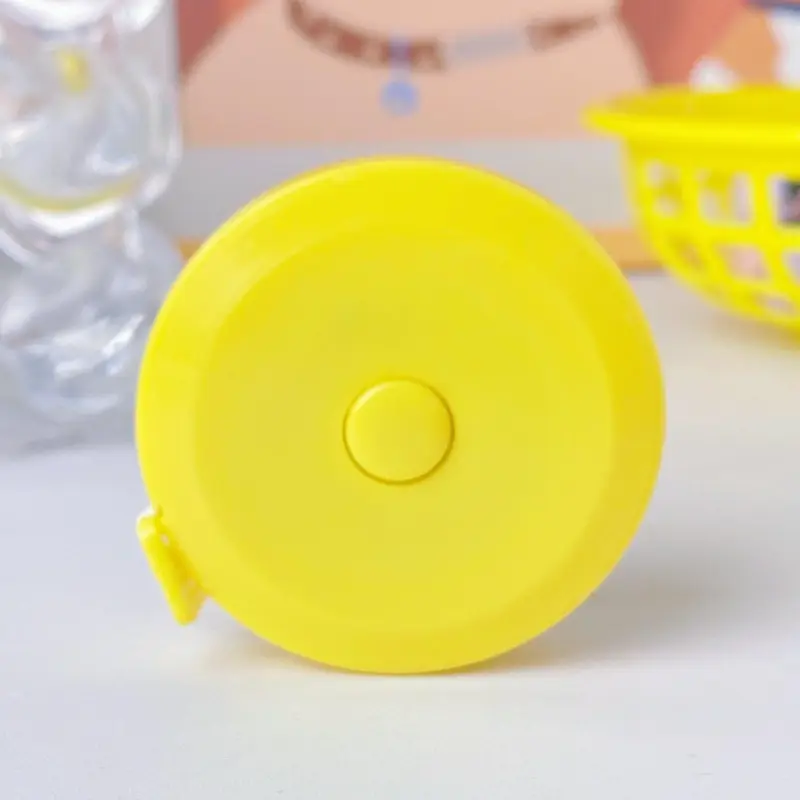 Soft pastel coloured double scale tape measure