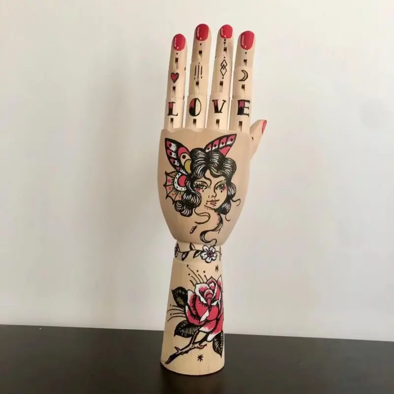 Tattooed mannequin handsornamentalliving simply house