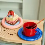 Three piece ceramic cups and saucers set