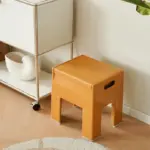 Versatile space age folding storage stool
